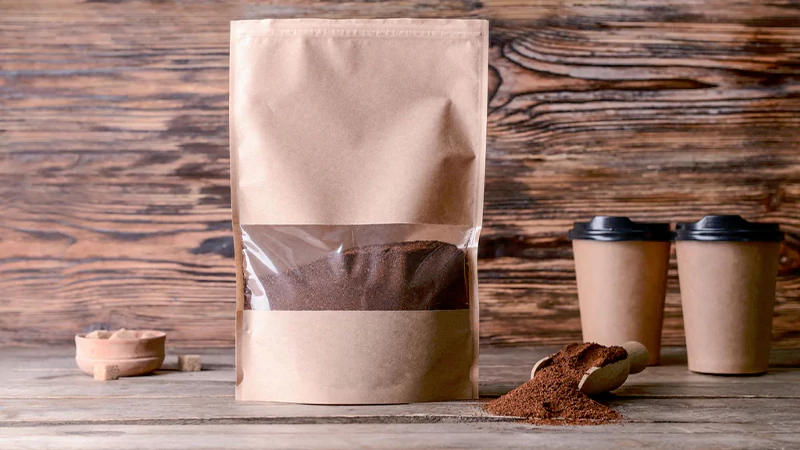 Coffee Grounds in a kraft bag